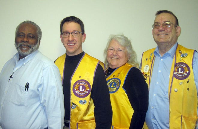 Edward Mitchell Jr., Chris Howard, and Charlotte and Lou Jones (from left) and their fellow Crestview Lions Club members. [RENEE BELL | News Bulletin]