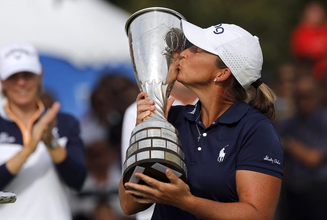 Angela Stanford of the U.S. poses with her trophy after winning the Evian Championship women's golf tournament in Evian, eastern France, Sunday, Sept. 16, 2018. [The Associated Press / Francois Mori]