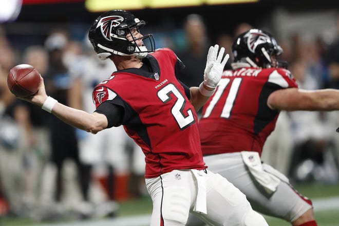 Falcons quarterback Matt Ryan (2) works against the Panthers during the second half on Sunday in Atlanta. [JOHN BAZEMORE/THE ASSOCIATED PRESS]
