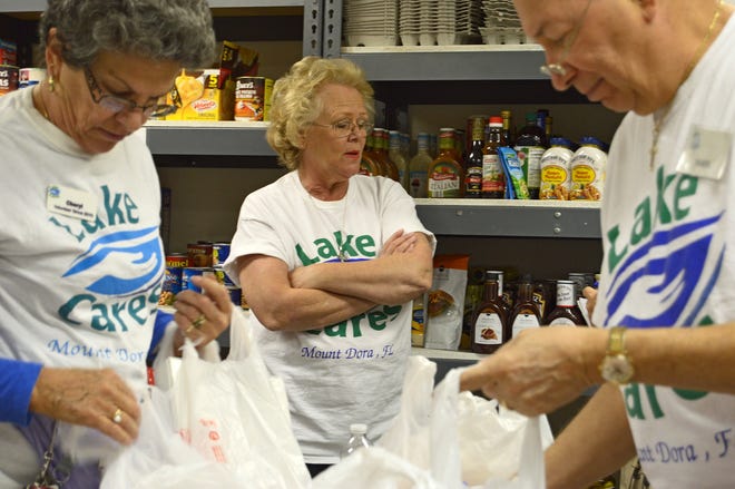 Executive Director Irene O'Malley poses for a photo on Wednesday, Jan. 20 at the Lake Cares Food Pantry in Mount Dora, Fla. O'Malley won the Lake County League of Cities Community Service Award for the humanitarian category in 2012. (Whitney Willard / Daily Commercial)