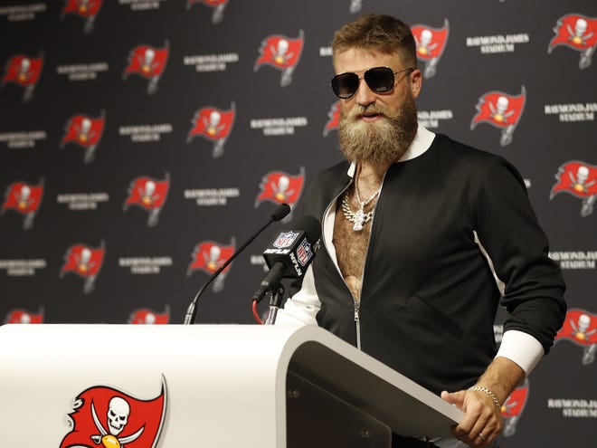 Ryan Fitzpatrick's post-game ensemble Sunday was nearly as shocking as his two-week numbers for the Bucs. [AP/Mark LoMoglio]
