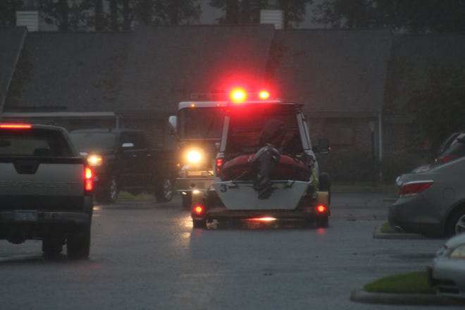 A rescue boat was at Fox Run Drive Saturday, September 15 around 6 p.m. when people reported flooding on the street and in their townhomes. [Brandon Davis / Free Press]