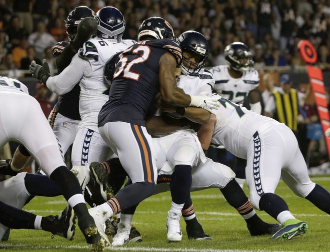 Bears linebacker Khalil Mack sacks Seattle Seahawks quarterback Russell Wilson (3) during the first half Monday in Chicago. [DAVID BANKS/THE ASSOCIATED PRESS]