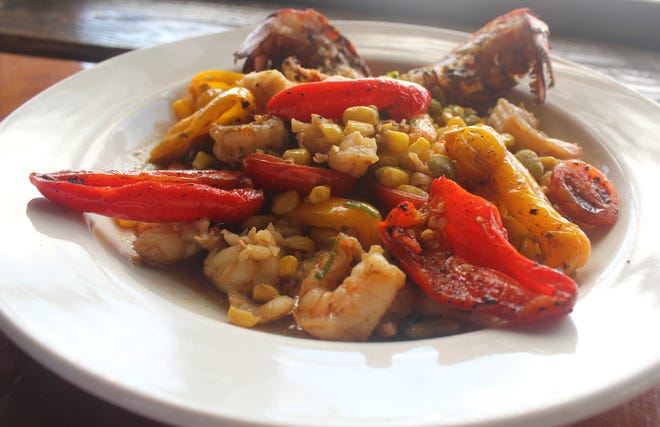 Lobster Succotash, Executive Chef Konrad Jochum's creation for Schooners' Lobster Feast on the Beach, is a traditional vegetable medley of corn, lima beans, red peppers, tomatoes and onions with lobster and shrimp. [JAN WADDY/THE NEWS HERALD]
