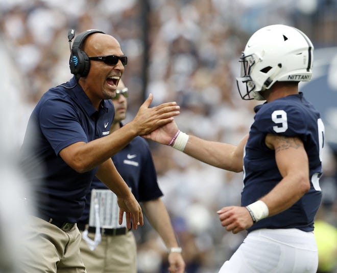 (File) Penn State head coach James Franklin congratulates quarterback Trace McSorley after the Nittany Lions scored a touchdown against Appalachian State. [CHRIS KNIGHT/ASSOCIATED PRESS]