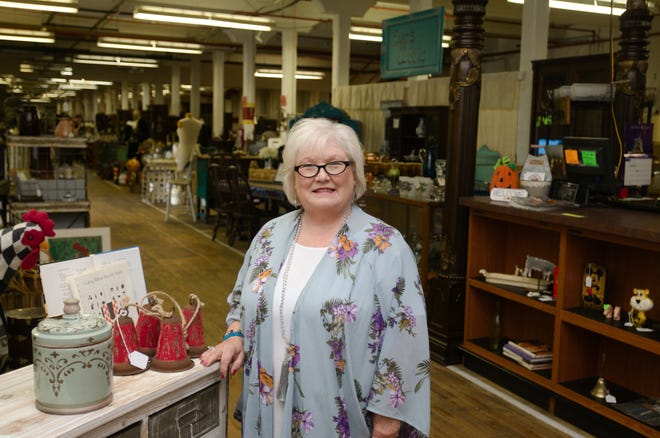 Pam Byars stands inside Wennonah Mills Consignment Emporium, which houses 50,000 square feet of anitques and treasures. [Ben Coley/The Dispatch]