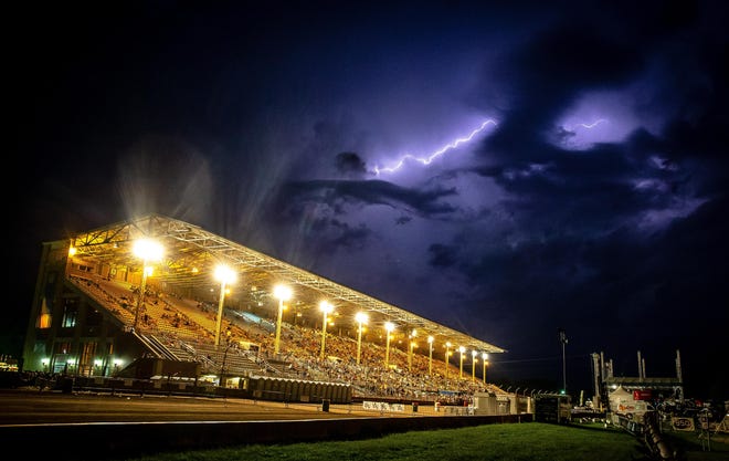 JUSTIN L. FOWLER/GATEHOUSE MEDIA ILLINOIS Lightning fills the sky as Illinois State Fair visitors attending the Thomas Rhett concert in the Grandstand take shelter as severe weather approaches on Aug. 16. The show, which pulled in the highest amount of ticket revenue of any concert at the 2018 fair, ended up being canceled, prompting all ticketholders to receive refunds.