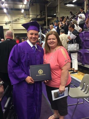 Tyler Smith and his mother, Sandy Halsne, celebrate his graduation from Western Illinois University earlier this year. The 23-year-old was found Saturday in Cedar Fork, the victim of an apparent drowning. (Submitted photo)