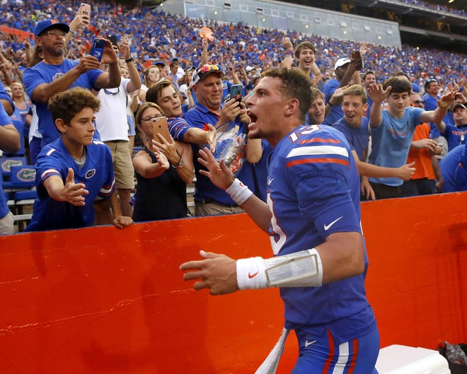 Florida quarterback Feleipe Franks celebrates with fans after throwing the game-winning touchdown against Tennessee at Ben Hill Griffin Stadium in Gainesville on Sept. 16. [Brad McClenny / The Gainesville Sun]