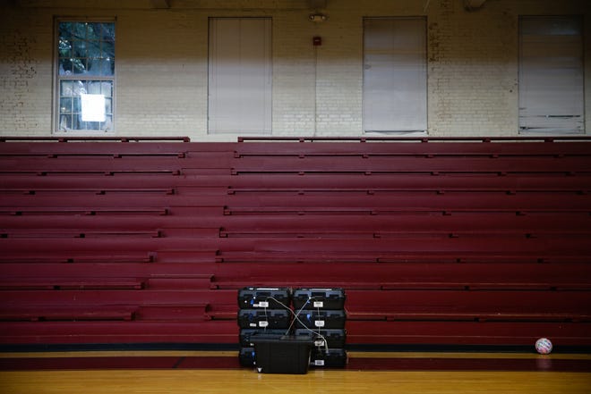 Electronic voting machines packed in cases sit on the floor following the Georgia primary runoff elections at a polling location in Atlanta on July 24, 2018. MUST CREDIT: Elijah Nouvelage, Bloomberg