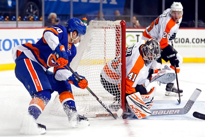 Philadelphia Flyers goaltender Anthony Stolarz makes a save on a shot by New York Islanders' Kieffer Bellows in the second period of a preseason NHL hockey game on Tuesday, Sept. 18, 2018, in New York. (AP Photo/Adam Hunger)