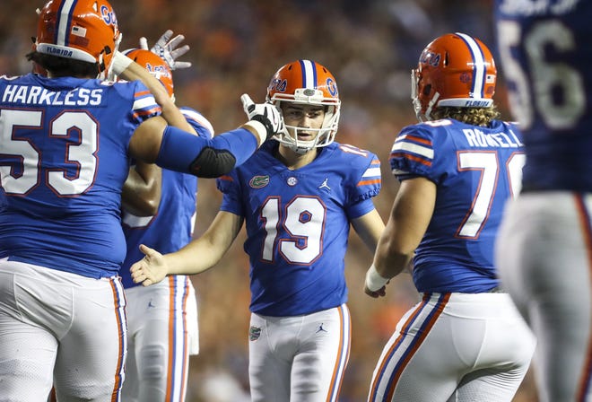 Florida kicker Evan McPherson (19) celebrates an extra point during the second quarter against Kentucky. [Monica Herndon/Tampa Bay Times]