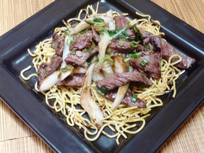 Vietnamese Stir-Fried Beef with Crispy Noodles. [Linda Gassenheimer/TNS]