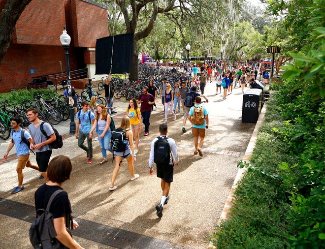 Students walk around the University of Florida campus on the first day of fall classes. [Brad McClenny/The Gainesville Sun]