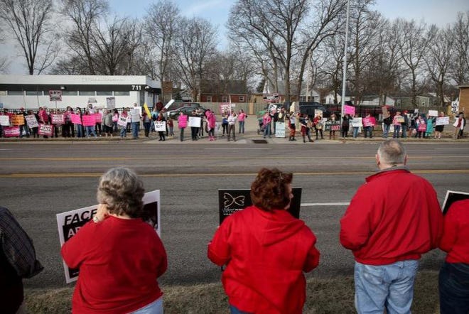 In this Feb. 11, 2017 photo, Planned Parenthood supporters, rear, stand across Providence Road from Planned Parenthood opponents during simultaneous protests outside the organization's Columbia health center. The Columbia clinic will stop providing abortions after Oct. 1 unless a federal judge decides to block enforcement of state restriction. [Columbia Tribune file]