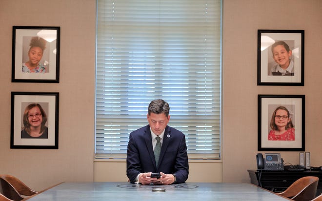 Oklahoma City Mayor David Holt responds to text messages as he works in the conference room in the Mayor's office at Oklahoma City Hall in Oklahoma City, Okla. on Thursday, Sept. 20, 2018. Photo by Chris Landsberger, The Oklahoman