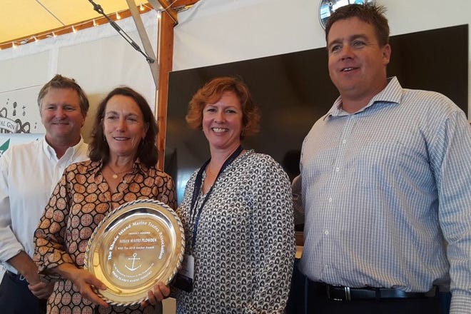 Susan Maffei Plowden of Jamestown received the RI Marine Trades Association Anchor Award for her work as stopover director of the 2017/18 Volvo Ocean Race Newport. Brad Reed of Sail Newport, left, presented the award. Also on hand were Wendy Mackie, RIMTA executive director; and Brandon Kidd, RIMTA president.