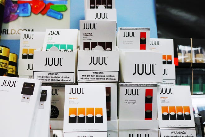 An assortment of flavor pods for JUUL electronic cigarette devices sit behind the counter of the VAPOR Smoke Shop in St. Augustine. The owner, Chris Olearczyk, says he has noticed a steady stream of customers under age 18 coming into his store over the last year. “Based on our evidence, we believe the presence of flavors is one component making these products especially attractive to kids,” the FDA wrote in a media release, expressing concern over JUUL flavors such as creme brulee, mango and fruit medley. [TRAVIS GIBSON/THE RECORD]
