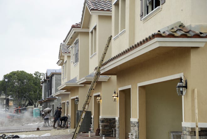 Prices of homes like these under construction in Tamarac are headed higher because of tariffs and a shortage of workers, new reports show. ASSOCIATED PRESS ARCHIVE / 2016]