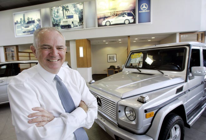 In this April 25, 2006, file photo, Mike Jackson, Chairman and Chief Executive Officer of AutoNation, poses at Mercedes-Benz of Fort Lauderdale in Fort Lauderdale, Fla. (AP Photo/Wilfredo Lee, File)
