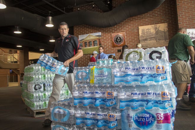 Beginning Monday, Gardner-Webb University is collecting supplies to help those affected by Hurricane Florence. Here, Neal Payne, associate minister to university for student ministries, helps with a Hurricane Harvey relief drive last year. [Special to The Star]