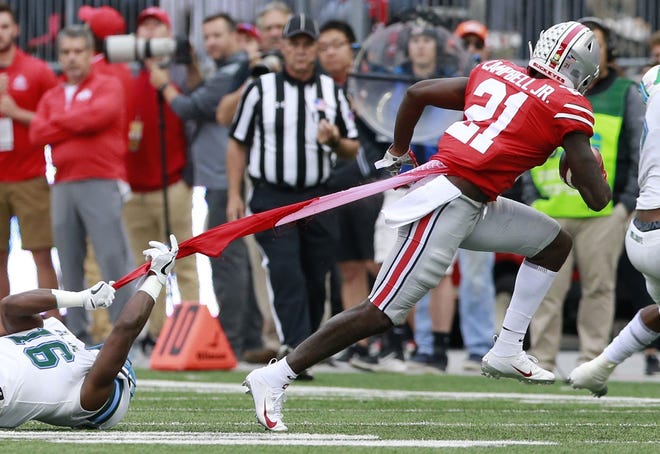 Ohio State receiver Parris Campbell leaves Tulane safety P.J. Hall, and part of his uniform, behind in the second quarter. [Brooke LaValley/Dispatch]