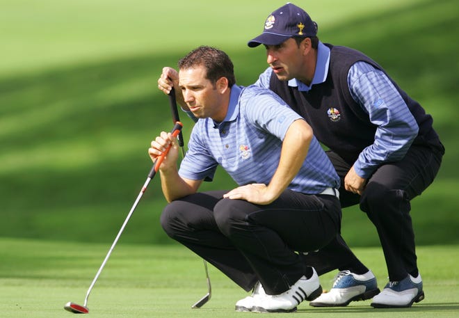 European partners Sergio Garcia (left) and Jose Maria Olazabal, preparing to drop another birdie putt in 2006, are two key figures in Europe's Ryder Cup success of the past 30 years. [Associated Press File]