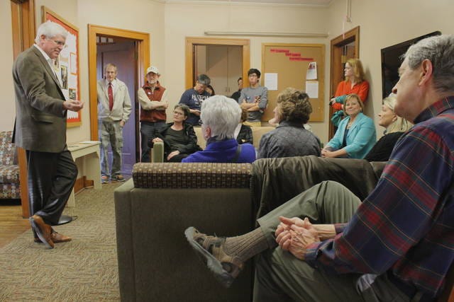 Former Democratic gubernatorial candidate Jack Hatch, left, speaks to a group in 2014 at Iowa State University’s Sloss House. FILE PHOTO/AMES TRIBUNE