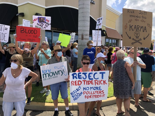 A big crowd of protesters beseiged a Rick Scott campaign event in Venice on Monday, criticizing the governor over his environmental record as red tide befouls the Southwest Florida coast. [Photo by Zac Anderson]