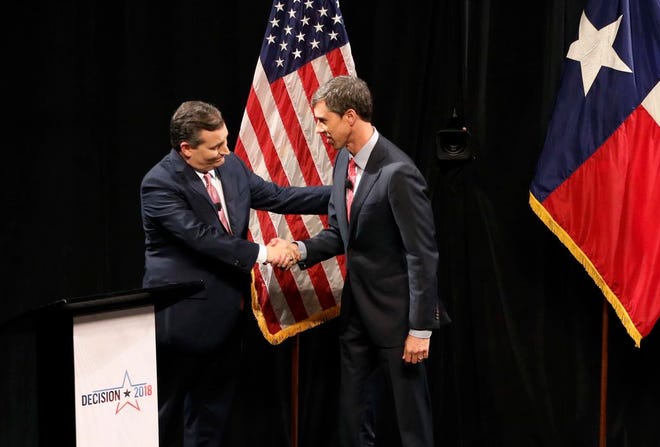 Republican U.S. Senator Ted Cruz, left, and Democratic U.S. Representative Beto O'Rourke, right, shake hands following their first debate for the Texas U.S. Senate in Dallas, Friday.