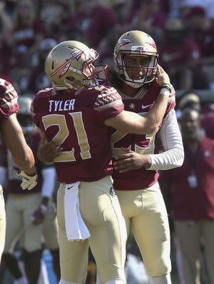 Florida State's field goal kicker Ricky Aguayo, right, and holder Logan Tyler celebrate after making a field goal against Northern Illinois in the second half of an NCAA college football game, Saturday in Tallahassee. [STEVE CANNON/AP PHOTO]