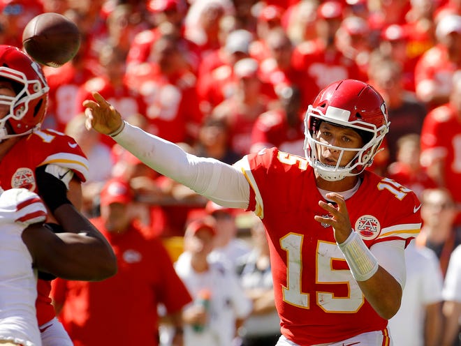 Kansas City Chiefs quarterback Patrick Mahomes (15) throws his third touchdown pass of the game during the first half of an NFL football game against the San Francisco 49ers in Kansas City, Mo., Sunday, Sept. 23, 2018. Mahomes' TDs surpass Peyton Manning for the most pass TDs by a quarterback in his team's first three games of the season in NFL history. [Charlie Riedel/The Associated Press]