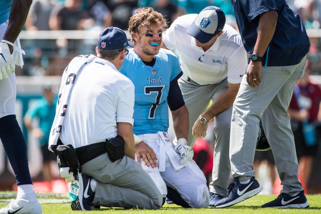 Tennessee Titans quarterback Blaine Gabbert (7) is shaken up after a sack by Jacksonville Jaguars defensive tackle Calais Campbell (93) Sunday. [For The Florida Times-Union/James Gilbert]