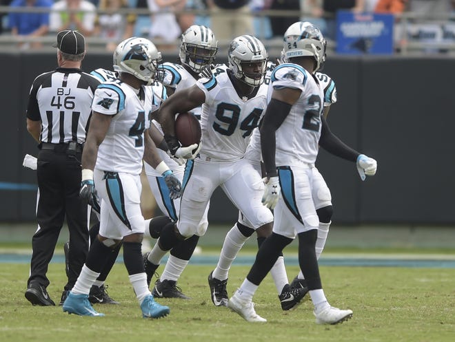 Carolina Panthers' Efe Obada (94) celebrates his fumble recovery during the second half of an NFL football game against the Cincinnati Bengals in Charlotte, N.C., Sunday, Sept. 23, 2018. (AP Photo/Mike McCarn)
