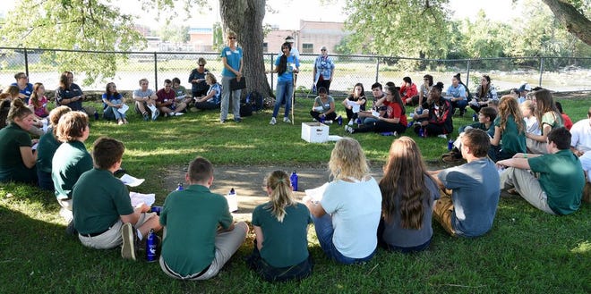 St. Mary's Catholic Central student and president of SMCC's Interact Club Ruchita Coomar, 17, lead the students gathered in the session called Creating Peace In Chaotic Times at Monroe County International Day of Peace Celebration 2018 held at St. Mary's Park in Monroe Friday. (Monroe News photo by TOM HAWLEY)