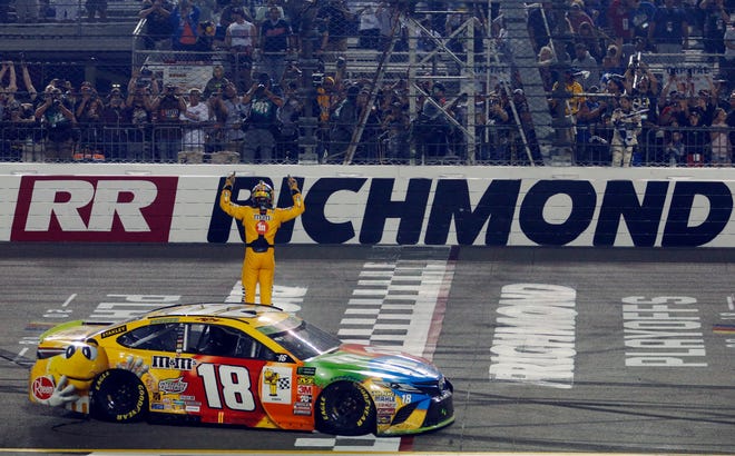 Kyle Busch celebrates winning the NASCAR Cup Series race at Richmond Raceway in Richmond, Va., Saturday. [AP PHOTO]