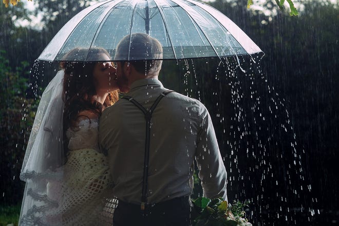 Rain on your wedding day is not ironic, its sheer luck! Rain and water can be interpreted as ancient symbols pointing towards a bountiful harvest and a fertile union. [BIG STOCK PHOTO]
