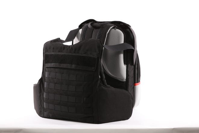 This undated photo provided by the Msada-Armour company, shows a bulletproof backpack. Masada-Armour, an Israeli company, says it has come up with a first-of-its-kind protection gear against the threat of school shootings -- a bulletproof backpack that can transform into a bulletproof vest in less than two seconds by flipping out an armored plate from a concealed compartment. [The Self Defense Company via AP]