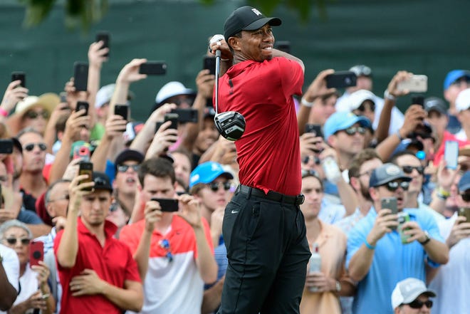 Tiger Woods hits from the third tee during the final round of the Tour Championship golf tournament Sunday, Sept. 23, 2018, in Atlanta.