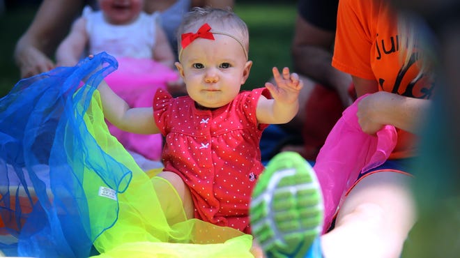 Palmer Carter, 10 months, dances along to music on the courtsquare for the Art of Sound festival on Saturday. [Brittany Randolph/The Star]