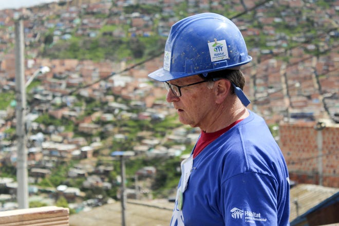 Tom Hutchison in Ciudad Sucre, a slum overlooking the city of Bogota, Colombia in 2016. [Photo courtesy Tom Hutchinson/Habitat for Humanity]