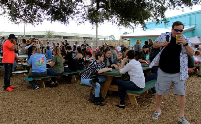 People attend an event at First Magnitude Brewery in Gainesville in January. [The Gainesville Sun, File]
