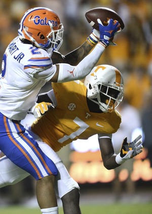 Florida defensive back Brad Stewart Jr. intercepts a pass away from Tennessee wide receiver Brandon Johnson in the third quarter Saturday in Knoxville, Tenn. [Joy Kimbrough/The Daily Times via AP]