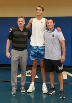 Gallipolis (Ohio) Gallia Academy center Zach Loveday is flanked by Ohio State coach Chris Holtmann, left, and Gallia Academy coach Gary Harrison, right. [Photo courtesy of Gary Harrison]