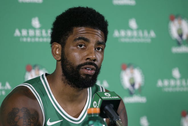 Celtics guard Kyrie Irving talks to reporters at media day on Monday in Canton. Enttering his second year with Boston, Irving said he's more comfortable. [AP Photo/Steven Senne]