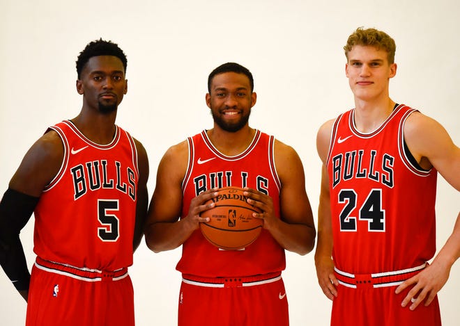 Chicago Bulls' Bobby Portis (5) Jabari Parker, center, and Lauri Markkanen (24) pose for a photo during media day at the NBA basketball team's facility Monday, Sept. 24, 2018, in Chicago. (AP Photo/David Banks)
