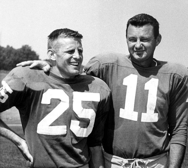 Philadelphia Eagles football players Tommy McDonald, left, and Norm Van Brocklin pose at training camp in Hershey, Pa., on Sept. 7, 1960. Hall of Famer Tommy McDonald has died at 84. His death was announced Monday, Sept. 24, 2018, by the Pro Football Hall of Fame. Details were not disclosed. (AP Photo/Sam Myers, File)