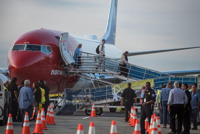 Norwegian Air passengers disembark from the first flight from Edinburgh, Scotland arriving at Stewart International Airport on June 15th, 2017. [KELLY MARSH/TIMES HERALD-RECORD FILE PHOTO]