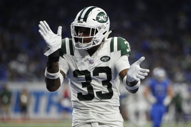 New York Jets strong safety Jamal Adams (33) reacts to a good play against the Detroit Lions during a game Sept. 10. [Jeff Haynes/AP Images]