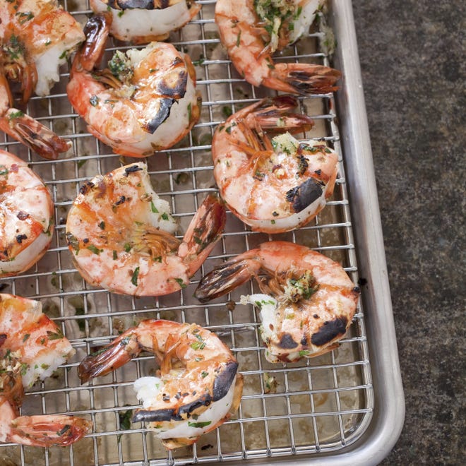 Garlicky roasted shrimp with parsley and anise. [Carl Tremblay/America's Test Kitchen via AP]